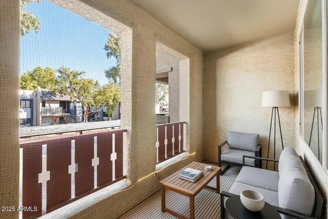 a living room with furniture and a window