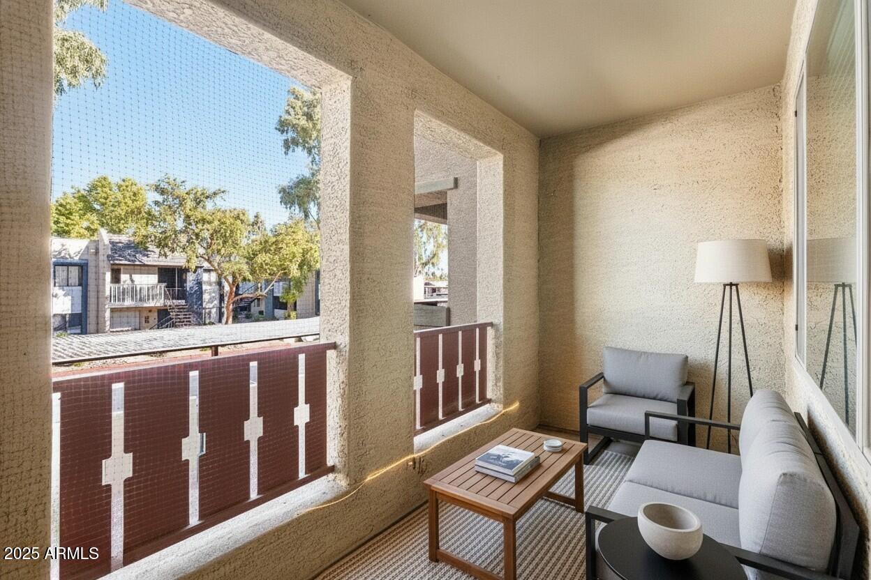 3250 West Greenway Road, Unit 151 Phoenix, AZ 85053 - Photo 15 of 31 a living room with furniture and a window