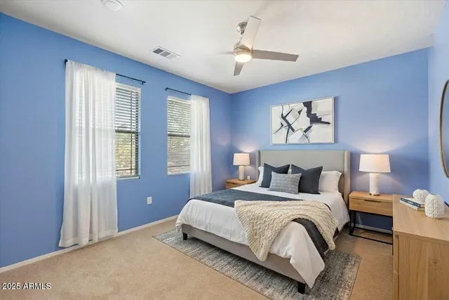 a bedroom with bed and a window