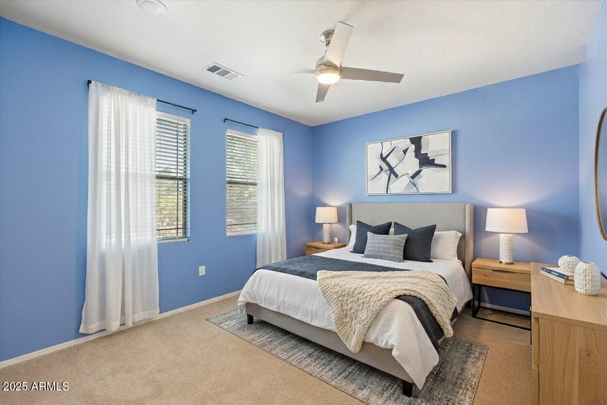 3250 West Greenway Road, Unit 151 Phoenix, AZ 85053 - Photo 16 of 31 a bedroom with bed and a window