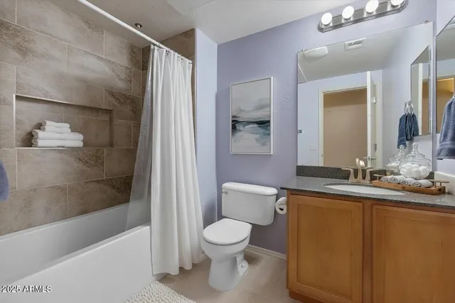 a bathroom with a toilet a sink and bathtub