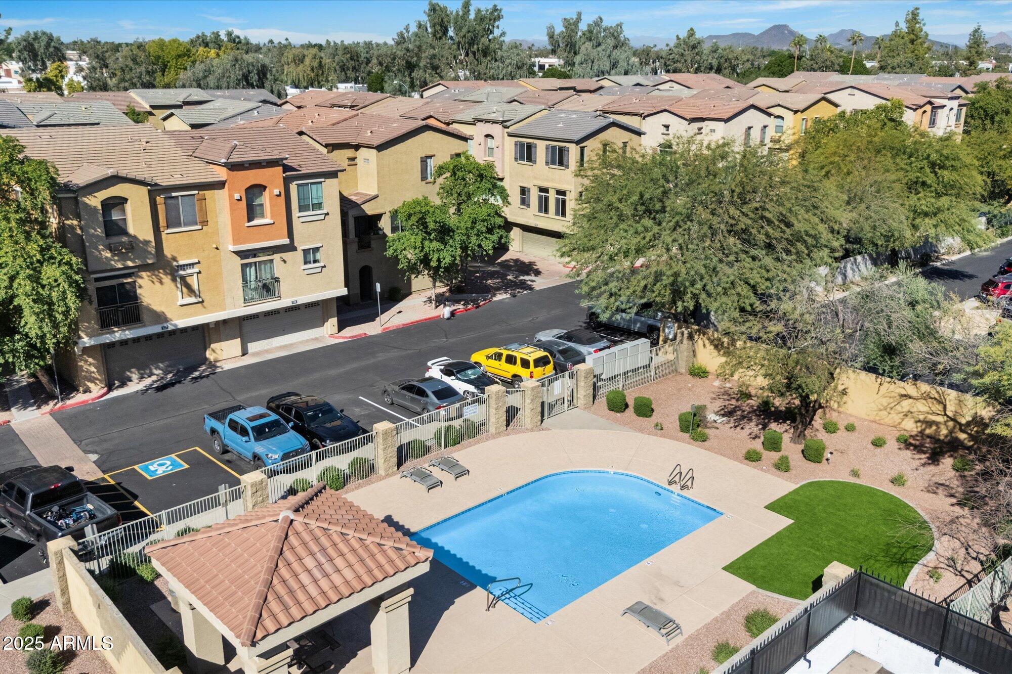 3250 West Greenway Road, Unit 151 Phoenix, AZ 85053 - Photo 26 of 31 an aerial view of residential houses with outdoor space