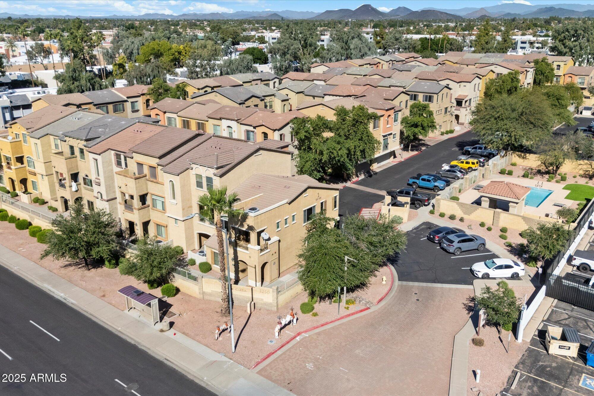 3250 West Greenway Road, Unit 151 Phoenix, AZ 85053 - Photo 31 of 31 an aerial view of residential houses with outdoor space