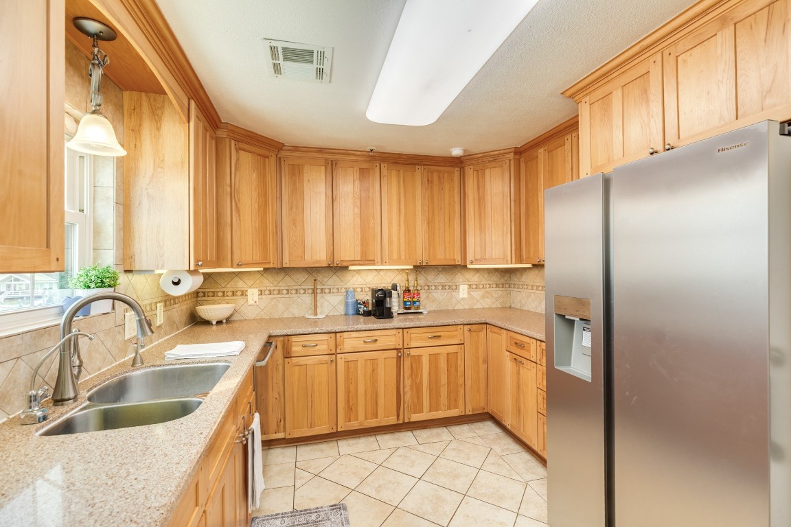 411 Sailfish Lane, Unit 101 Freeport, TX 77541 - Photo 17 of 40 a kitchen with a sink cabinets and appliances