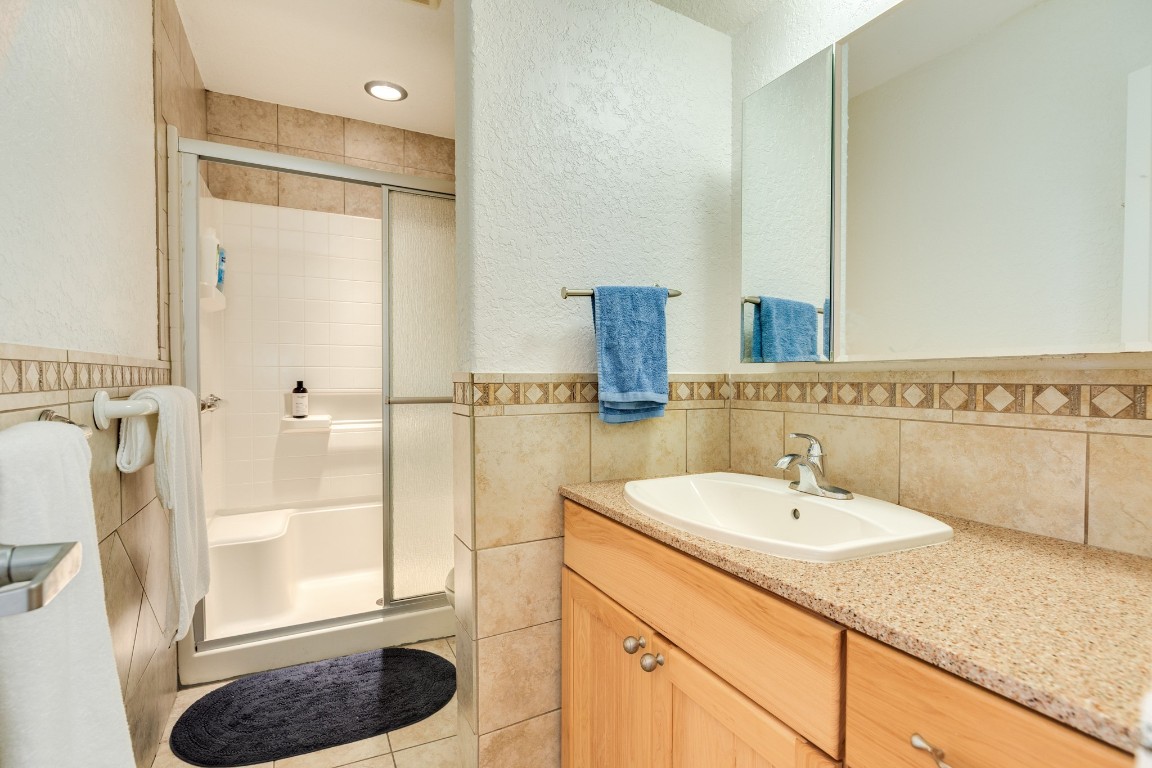 411 Sailfish Lane, Unit 101 Freeport, TX 77541 - Photo 22 of 40 a bathroom with a sink and a mirror
