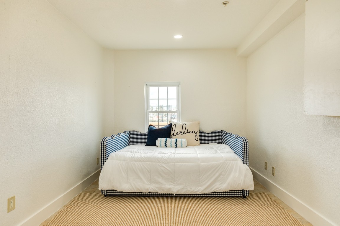 411 Sailfish Lane, Unit 101 Freeport, TX 77541 - Photo 27 of 40 a bedroom with a bed and a window