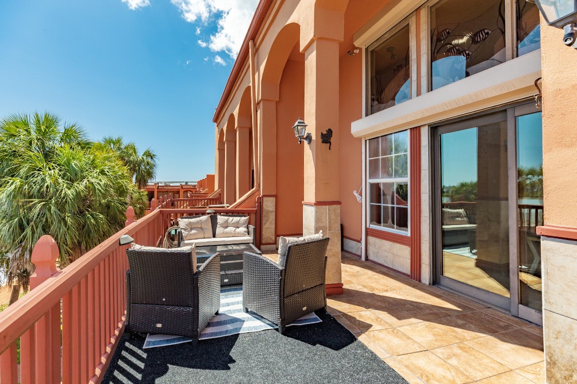 411 Sailfish Lane, Unit 101 Freeport, TX 77541 - Photo 31 of 40 a view of a two chairs and table in the balcony