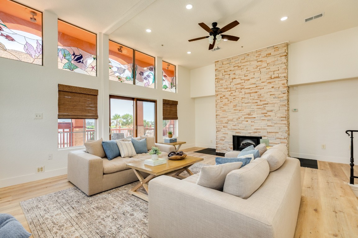 411 Sailfish Lane, Unit 101 Freeport, TX 77541 - Photo 4 of 40 a living room with furniture ceiling fan and a rug