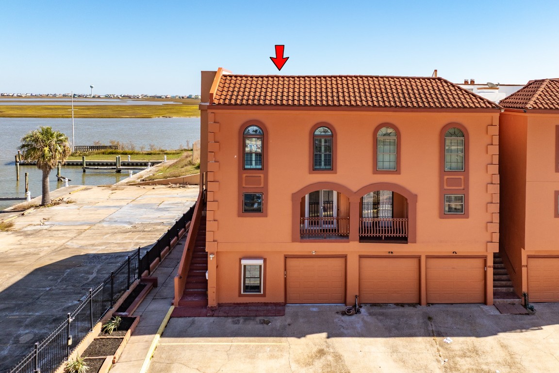 411 Sailfish Lane, Unit 101 Freeport, TX 77541 - Photo 7 of 40 a front view of a house with a yard