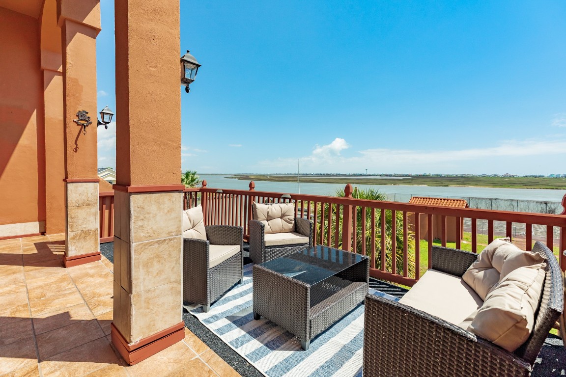 411 Sailfish Lane, Unit 101 Freeport, TX 77541 - Photo 8 of 40 a roof deck with couches and wooden floor