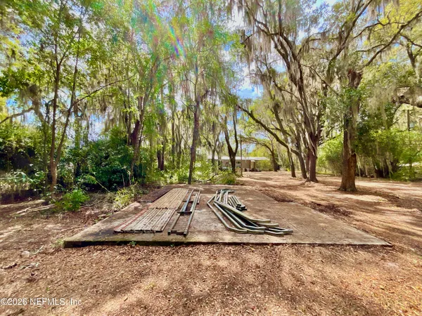 a view of a yard with trees