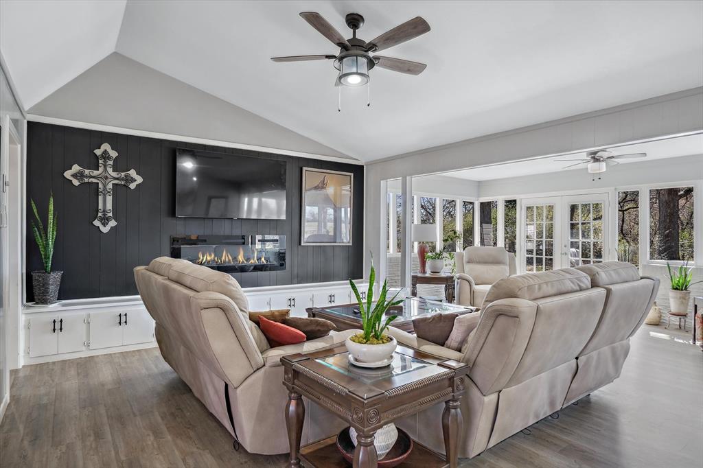 103 Brandon Street Edgewood, TX 75117 - Photo 11 of 29 a living room with furniture a ceiling fan and a flat screen tv