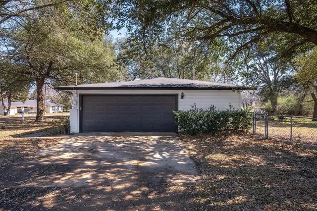 a view of a house with a tree