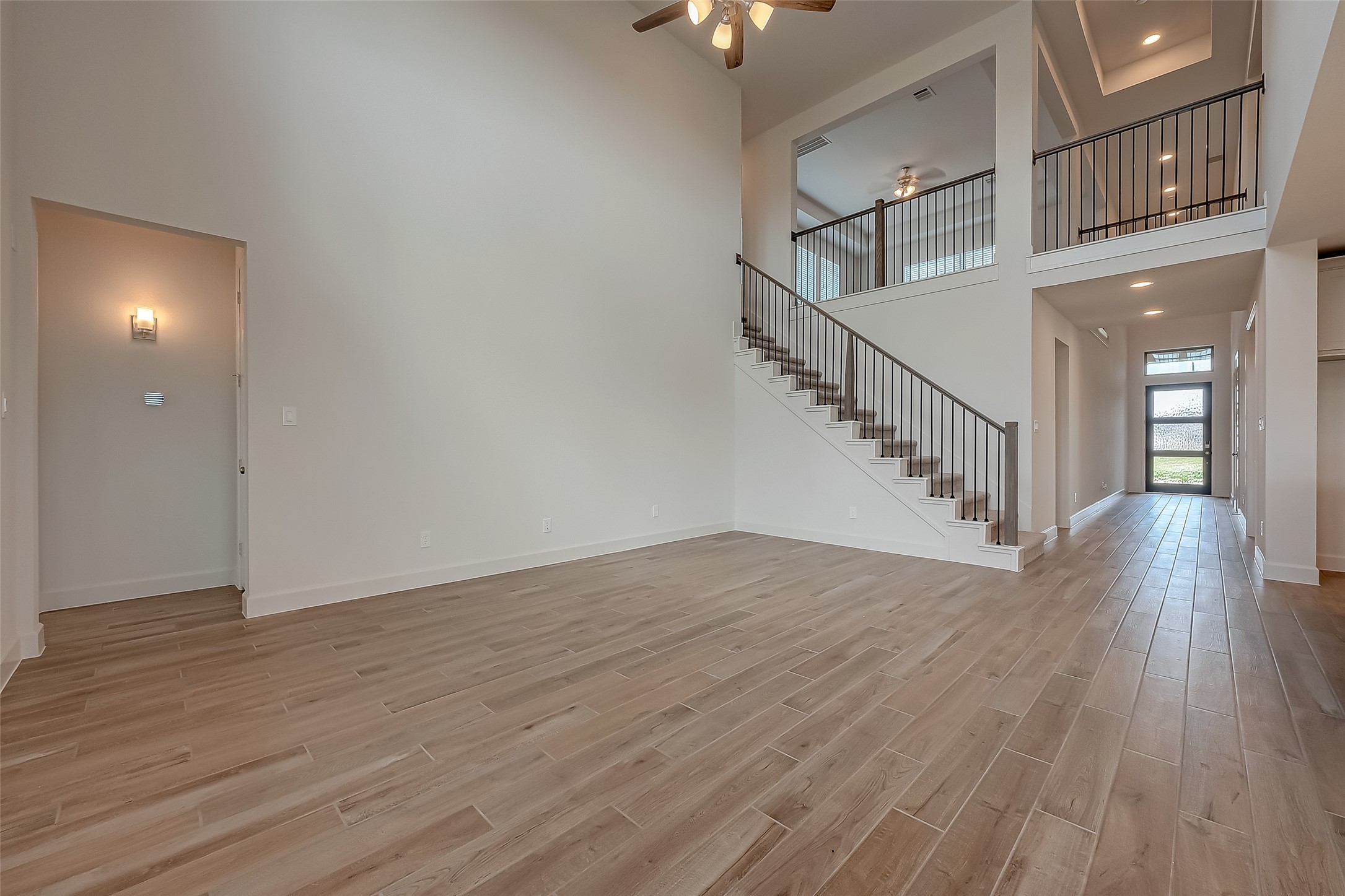 30223 GOLD FINCH Place Fulshear, TX 77441 - Photo 12 of 45 a view of entryway and hall with wooden floor