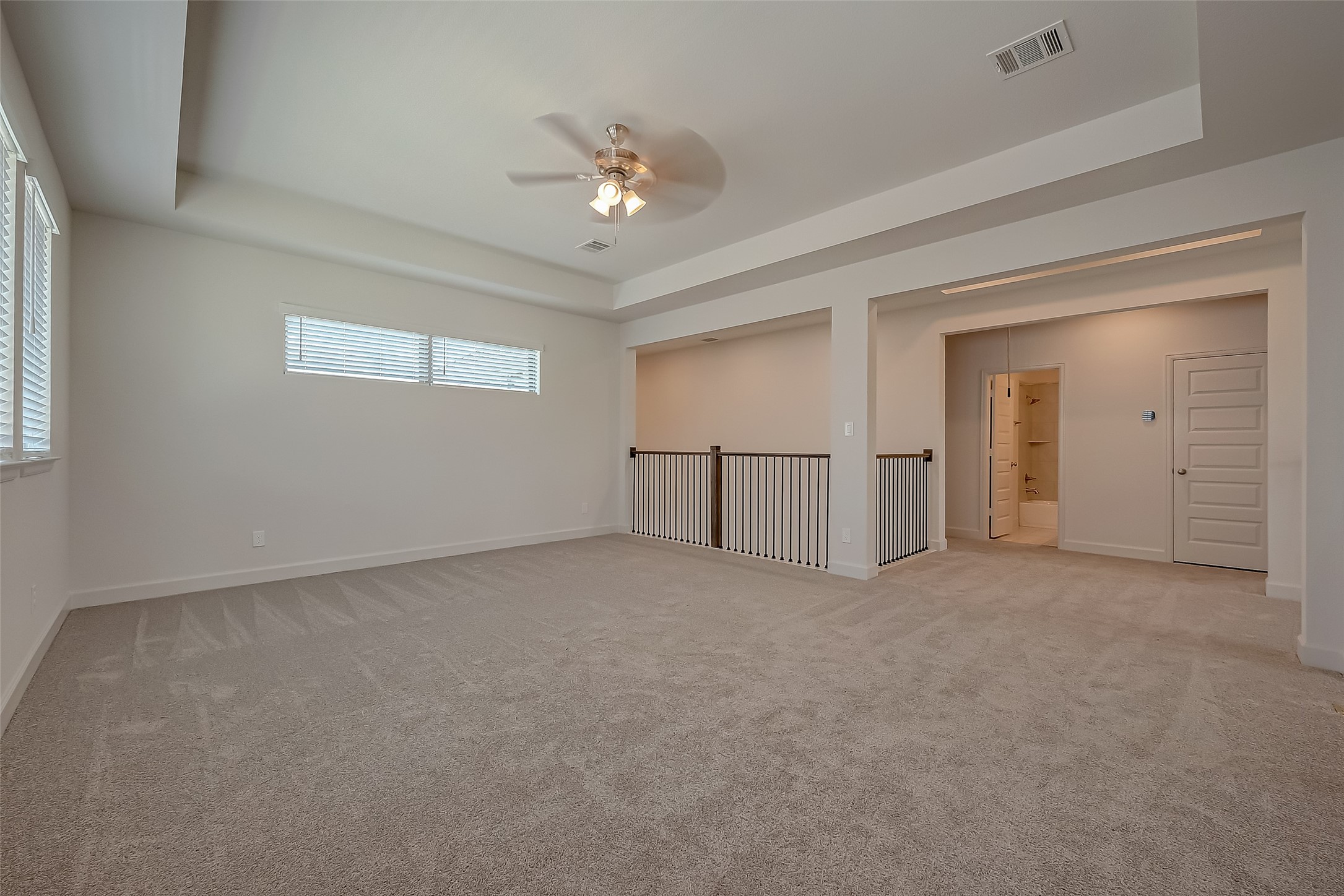 30223 GOLD FINCH Place Fulshear, TX 77441 - Photo 26 of 45 a view of an empty room with chandelier fan and fire place