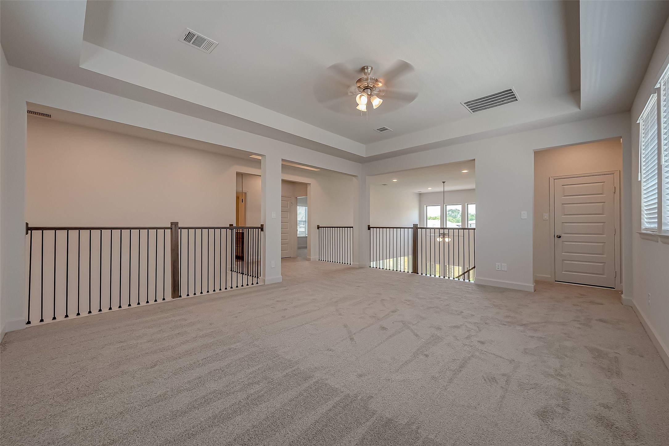 30223 GOLD FINCH Place Fulshear, TX 77441 - Photo 27 of 45 a view of an empty room with a chandelier fan