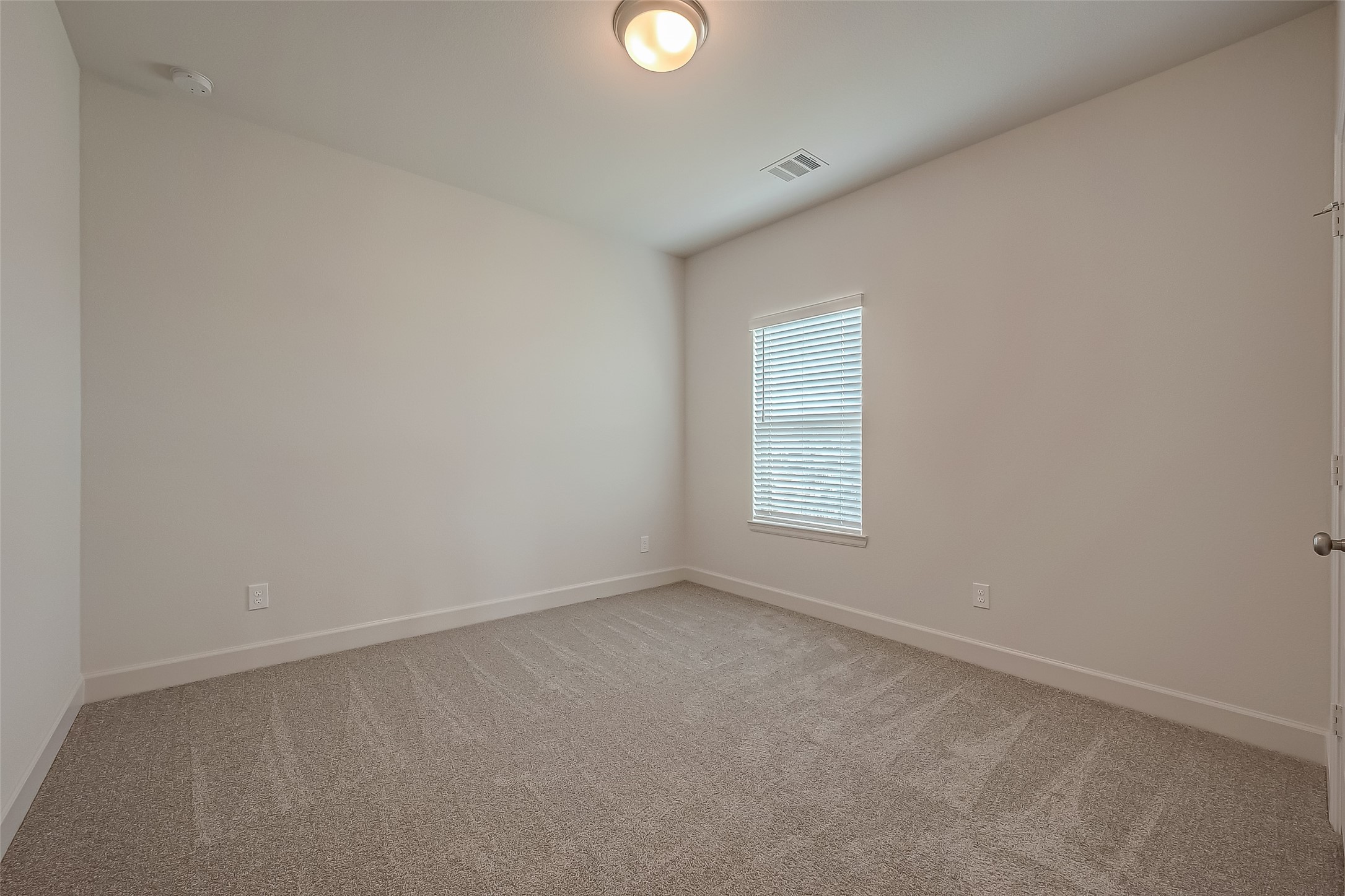 30223 GOLD FINCH Place Fulshear, TX 77441 - Photo 29 of 45 an empty room with windows and with windows