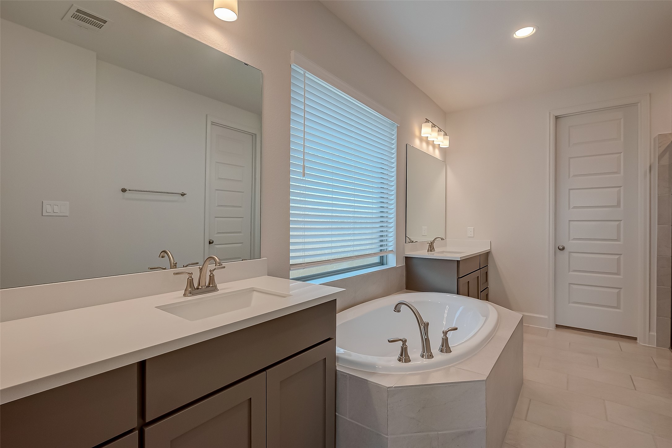 30223 GOLD FINCH Place Fulshear, TX 77441 - Photo 37 of 45 a bathroom with a sink and a bathtub