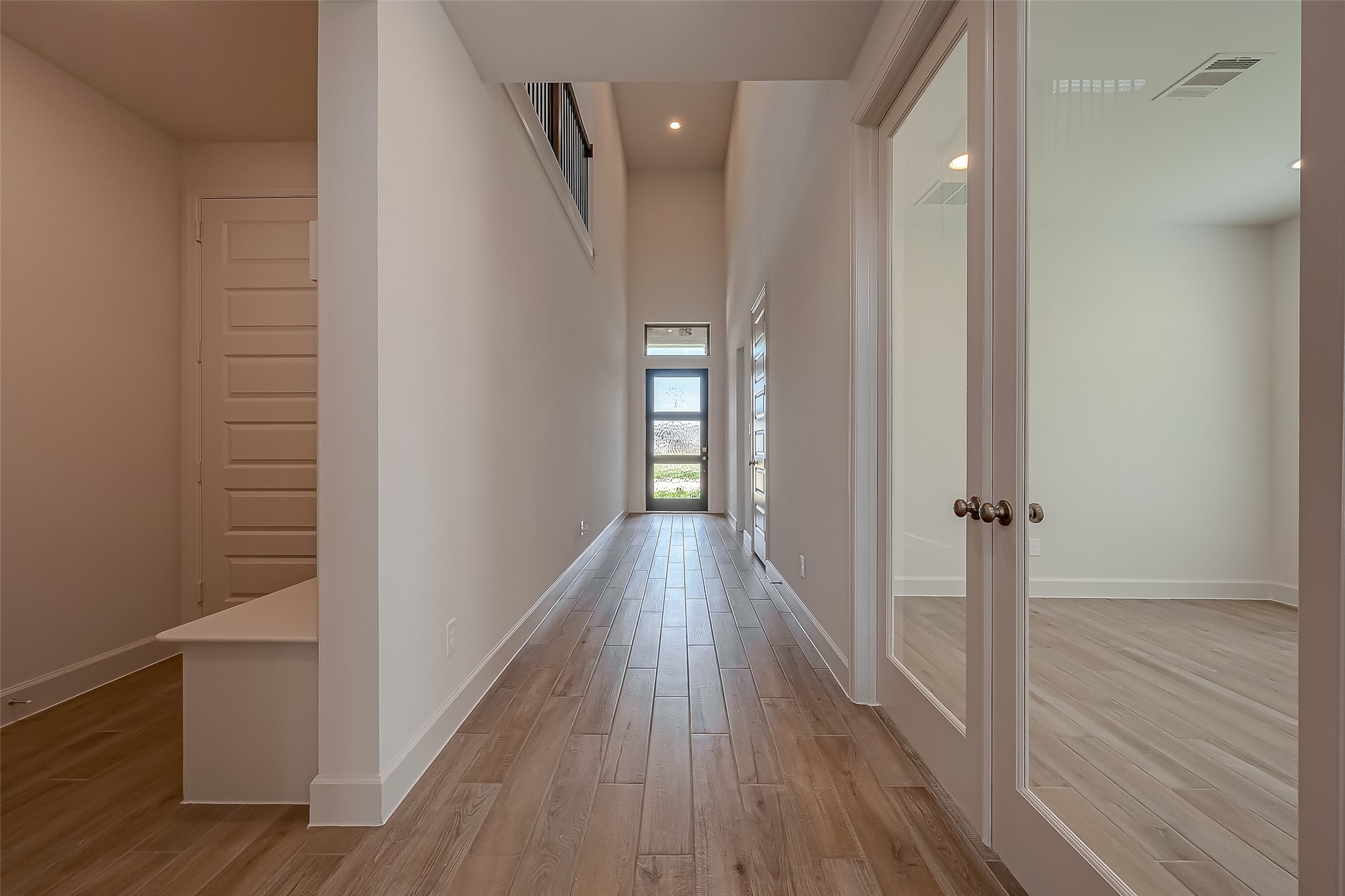 30223 GOLD FINCH Place Fulshear, TX 77441 - Photo 6 of 45 a view of hallway with wooden floor