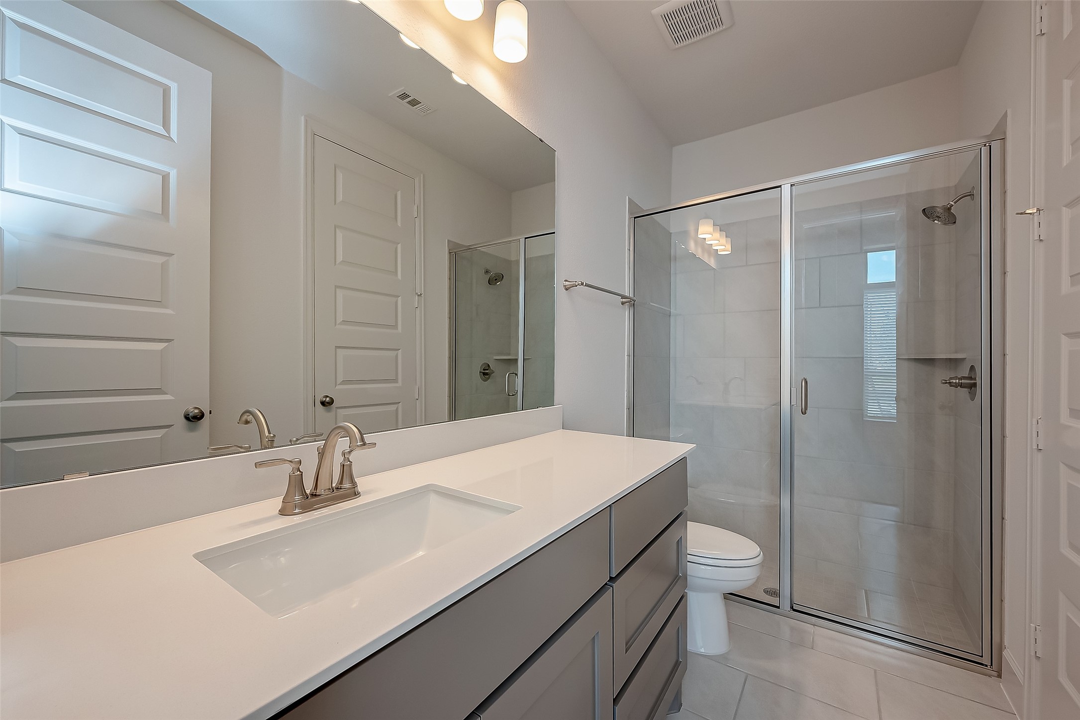 30223 GOLD FINCH Place Fulshear, TX 77441 - Photo 9 of 45 a bathroom with a sink a toilet and shower