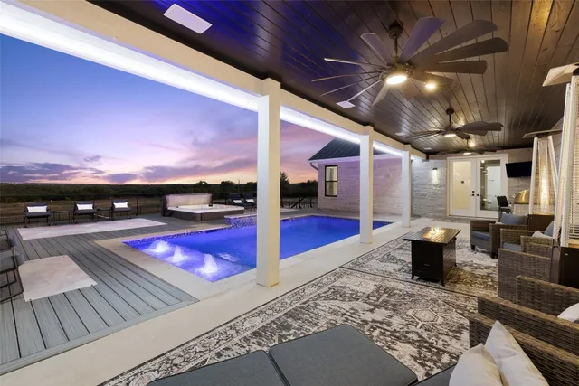 a dinning area with pool table and chairs