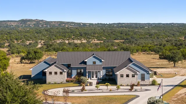 an aerial view of residential houses and street