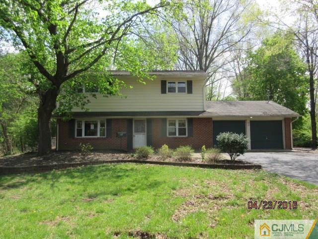 28 Raleigh Road Kendall Park, NJ 08824 - Photo 1 of 16 a front view of house with yard outdoor seating and yard