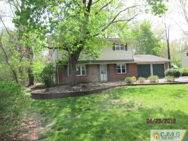 28 Raleigh Road Kendall Park, NJ 08824 - Photo 2 of 16 a front view of a house with a garden