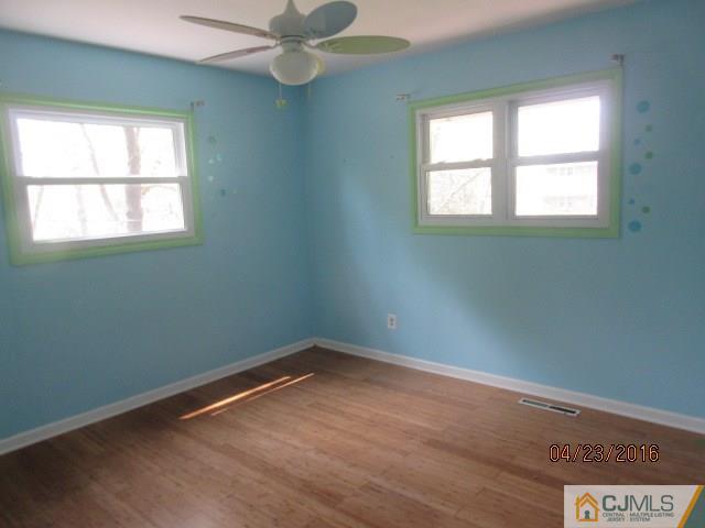 28 Raleigh Road Kendall Park, NJ 08824 - Photo 11 of 16 an empty room with a window