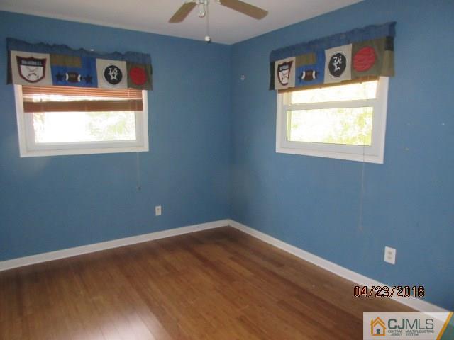28 Raleigh Road Kendall Park, NJ 08824 - Photo 15 of 16 a view of an empty room with a window