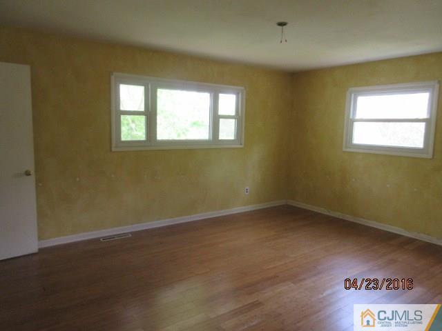28 Raleigh Road Kendall Park, NJ 08824 - Photo 10 of 16 an empty room with a window