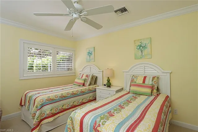 a bedroom with bed and a window