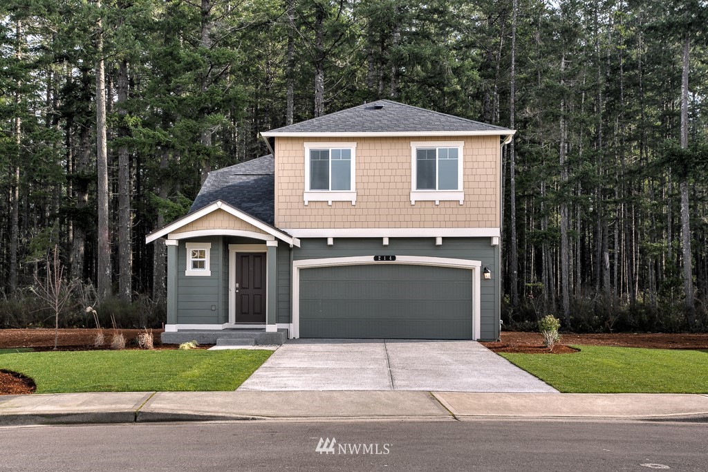 207 169th Place Southwest Bothell, WA 98012 - Photo 1 of 21 a front view of a house with a yard and garage