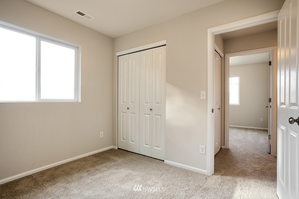 207 169th Place Southwest Bothell, WA 98012 - Photo 14 of 21 an empty room with windows and closet