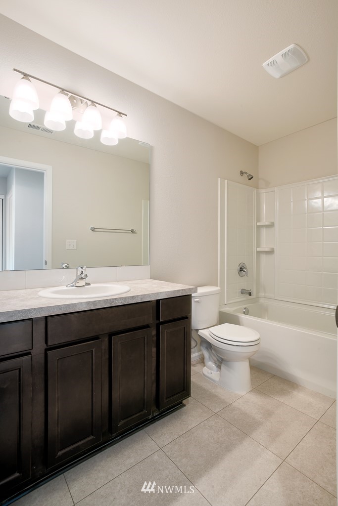 207 169th Place Southwest Bothell, WA 98012 - Photo 15 of 21 a bathroom with a double vanity sink mirror and toilet
