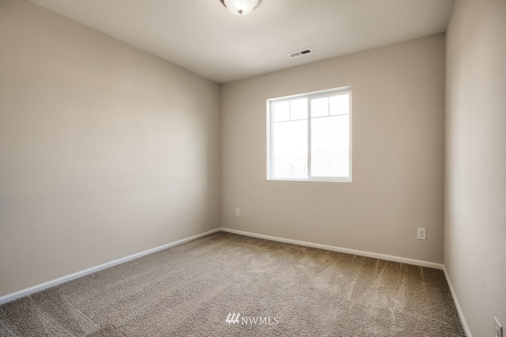 207 169th Place Southwest Bothell, WA 98012 - Photo 17 of 21 an empty room with a window