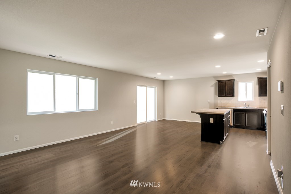 207 169th Place Southwest Bothell, WA 98012 - Photo 4 of 21 a large white kitchen with a large window