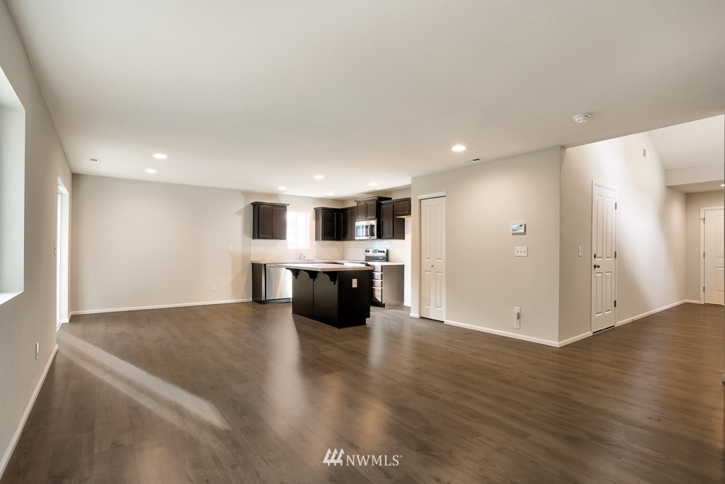 207 169th Place Southwest Bothell, WA 98012 - Photo 5 of 21 a large white kitchen with a white countertops oven and a sink