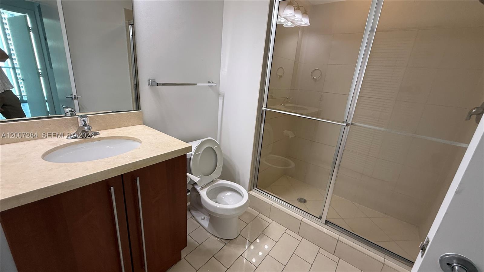 79 Southwest 12th Street, Unit 2509S Miami, FL 33130 - Photo 15 of 27 a bathroom with a sink toilet and shower