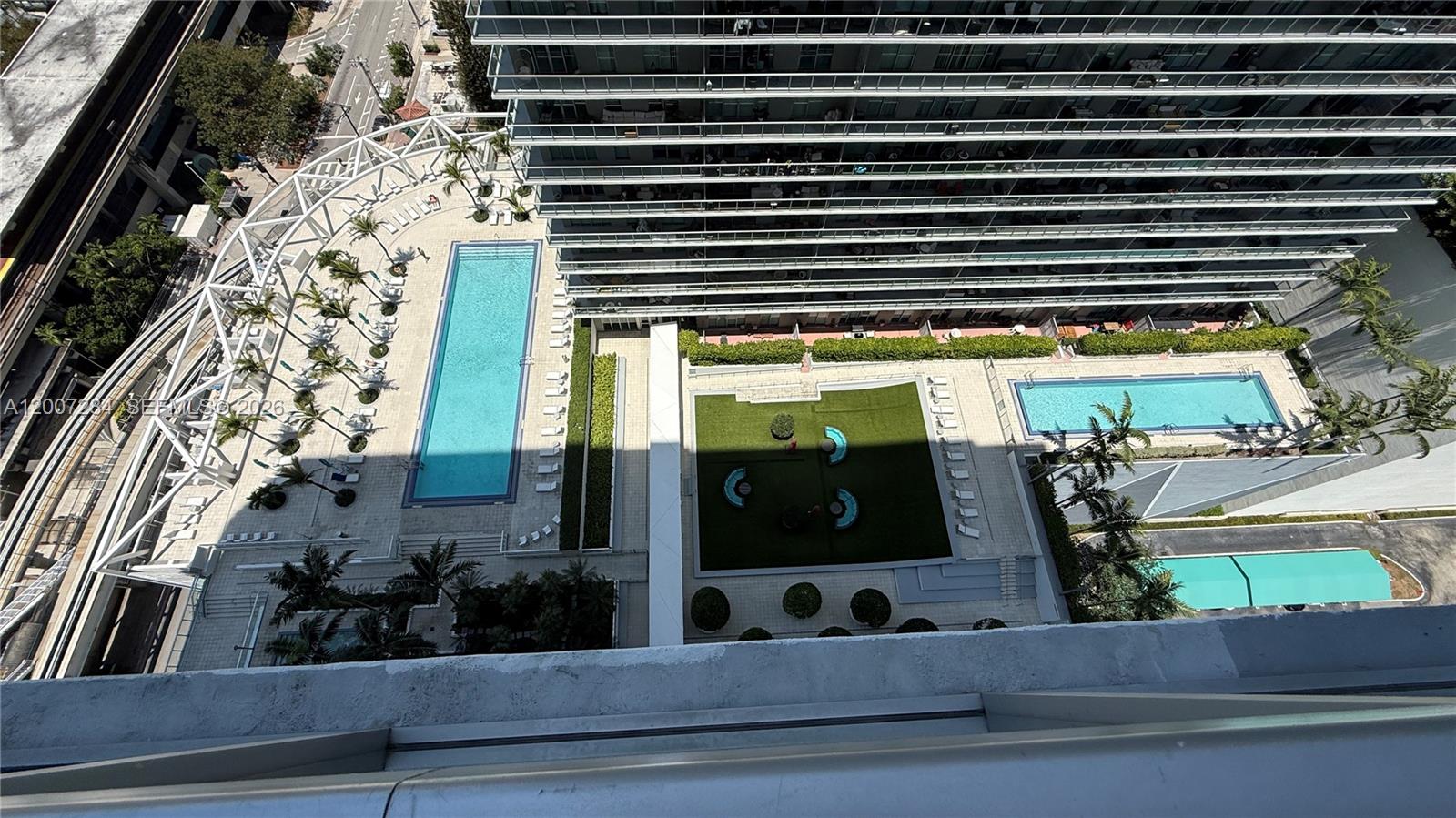 79 Southwest 12th Street, Unit 2509S Miami, FL 33130 - Photo 18 of 27 a view of swimming pool from a window