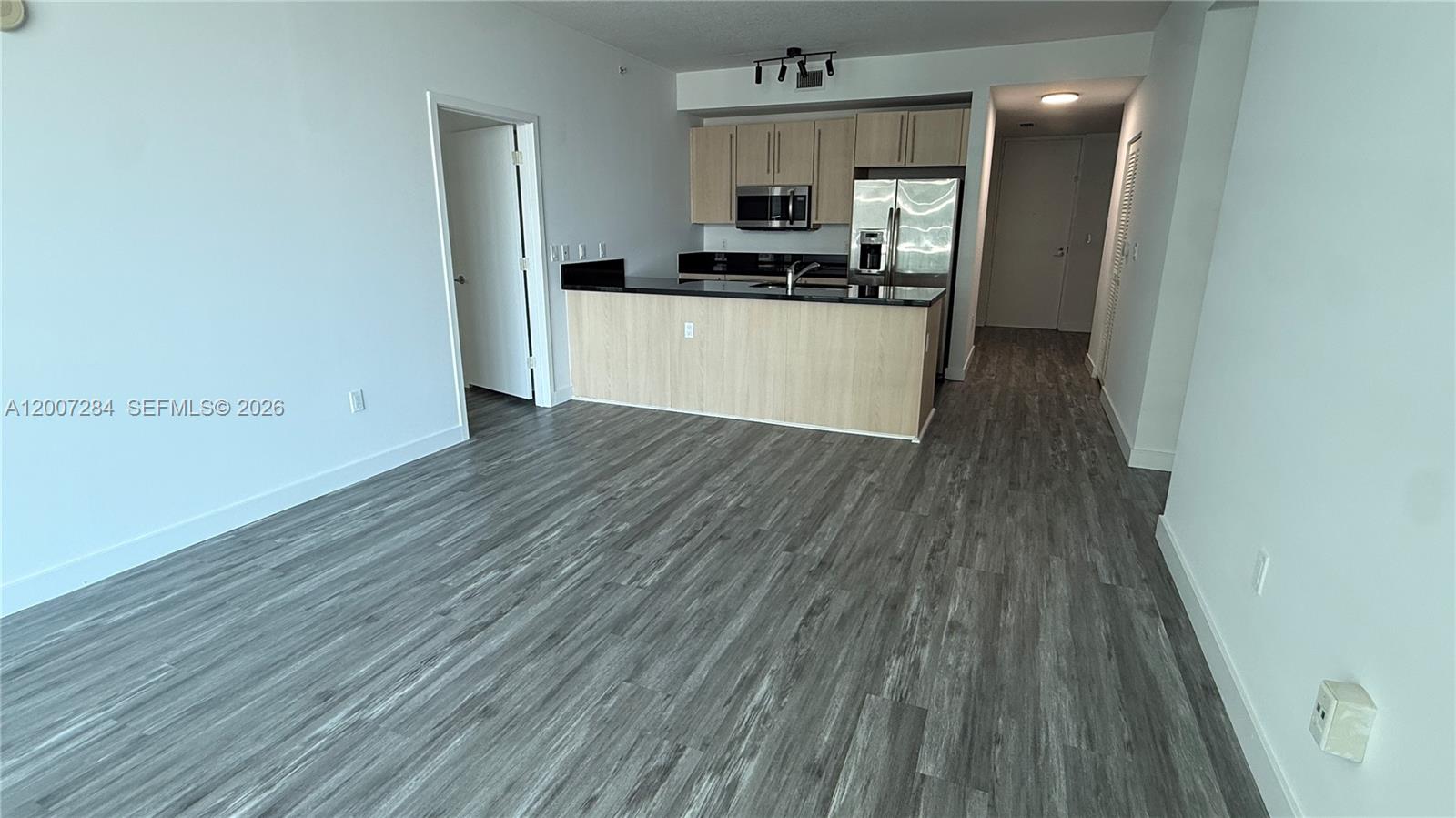 79 Southwest 12th Street, Unit 2509S Miami, FL 33130 - Photo 2 of 27 a view of a kitchen from the hallway