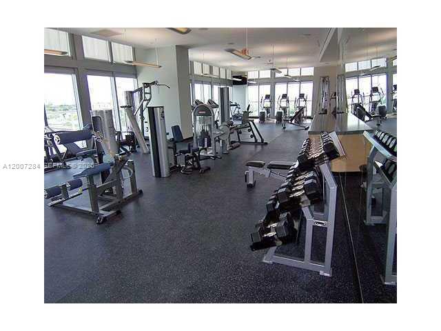 79 Southwest 12th Street, Unit 2509S Miami, FL 33130 - Photo 21 of 27 a view of a room with gym equipment