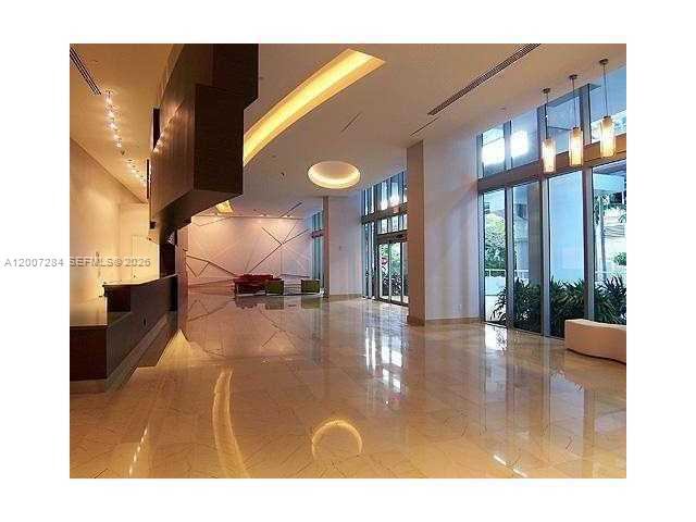 79 Southwest 12th Street, Unit 2509S Miami, FL 33130 - Photo 26 of 27 a lobby with furniture and floor to ceiling window