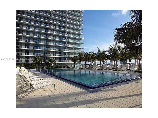 79 Southwest 12th Street, Unit 2509S Miami, FL 33130 - Photo 27 of 27 a view of swimming pool with outdoor seating and plants