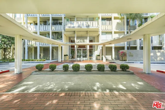 a bathroom with a double vanity sink and mirror