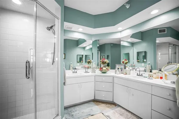 a bathroom with a sink mirror vanity and toilet