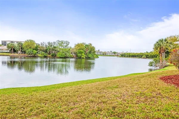 a view of a lake with a bench in front of lake