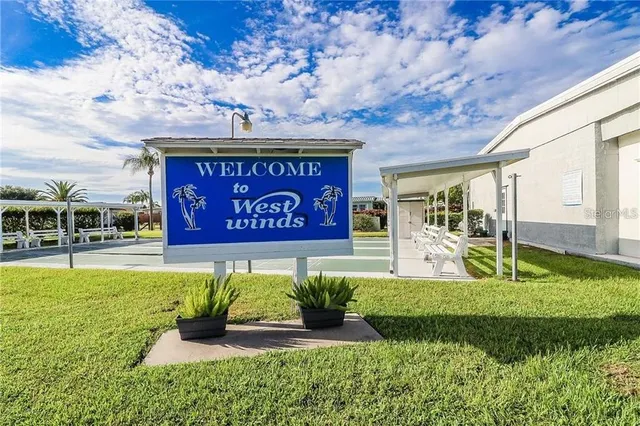 a view of a patio with table and chairs potted plants with a barbeque grill and plants