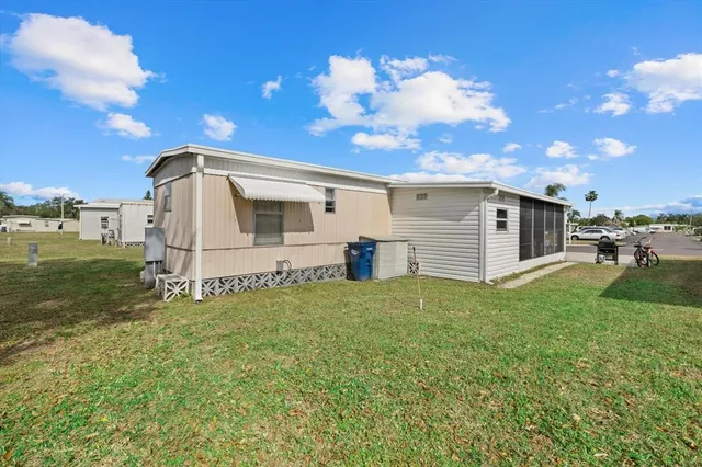 a view of a backyard with a garden and entertaining space