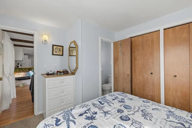 a bedroom with a bed and a dresser